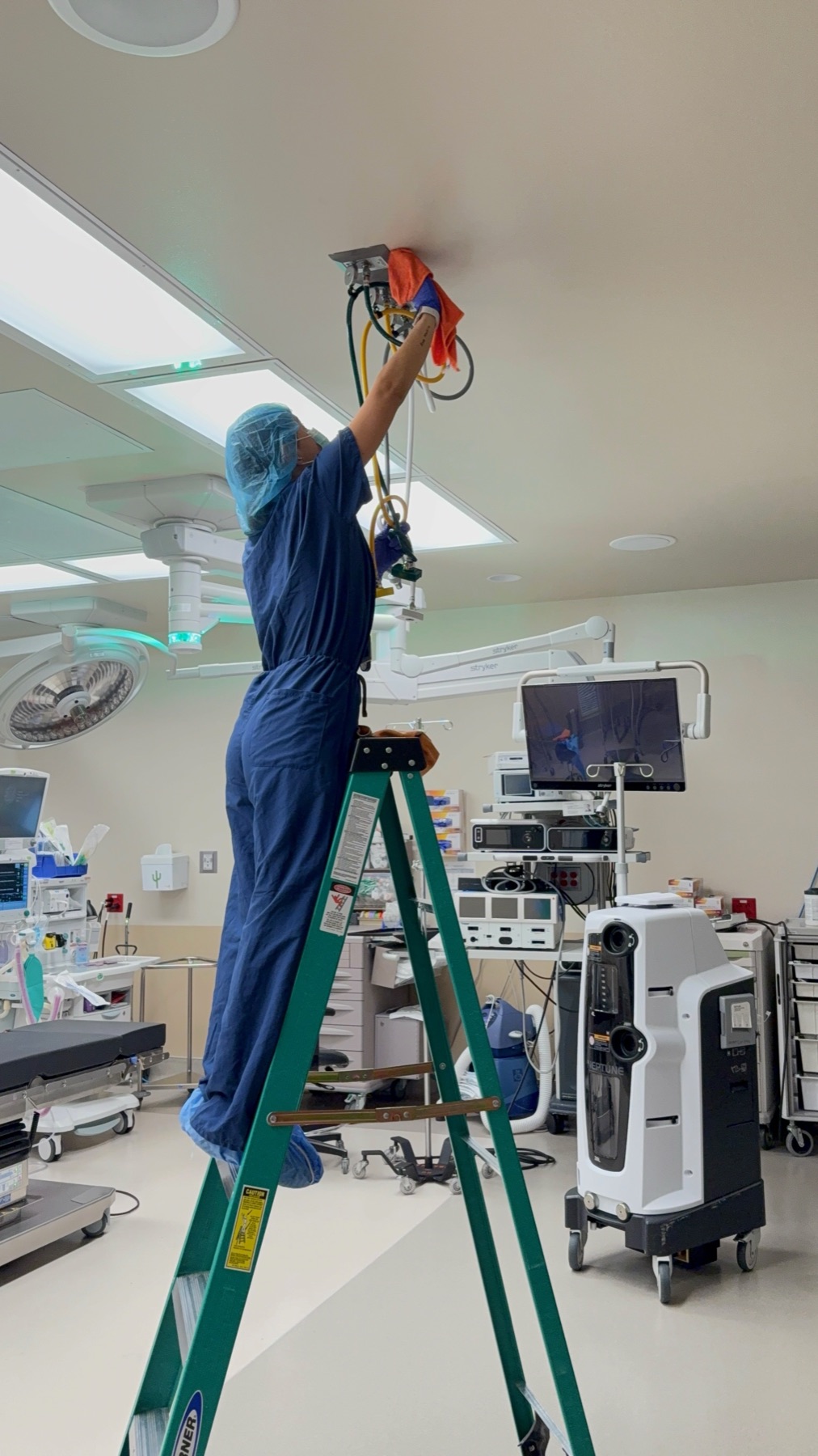 Technician working above the operating table